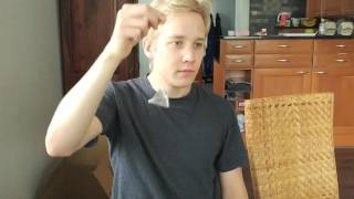 Man dipping tea bag into his mouth