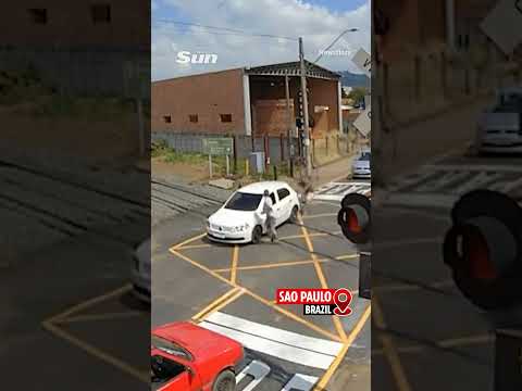Dramatic moment train hits car stuck on a railway crossing