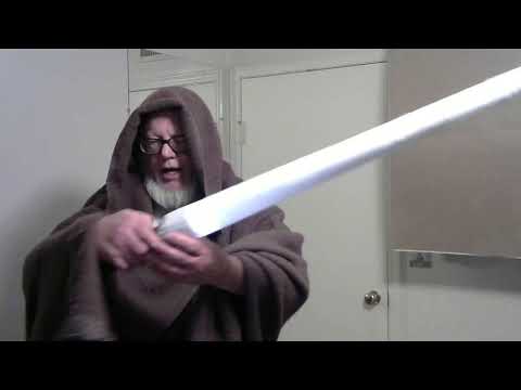 Obi Wan Kenobi gives Luke his light-saber