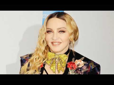 Madonna Seductively Sucks on Pink Candy Backstage