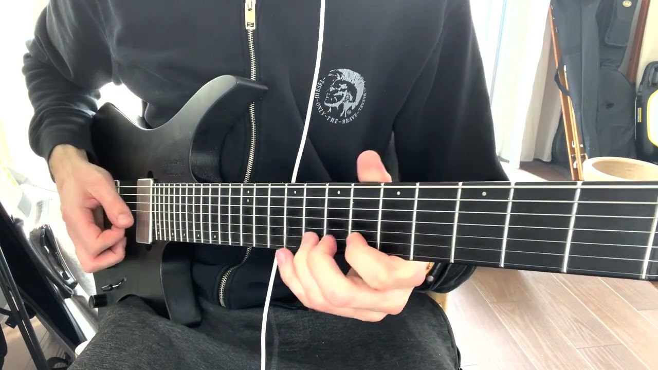 Guitarist bending a string in a minor pentatonic position for an expressive lick