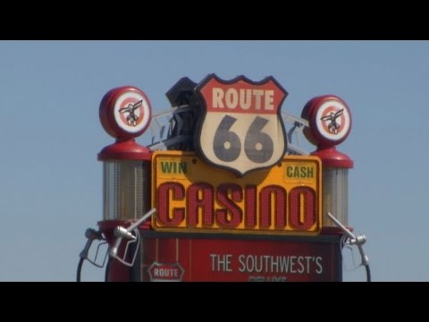 Woman hits man with car, pulls gun in fight over parking spot