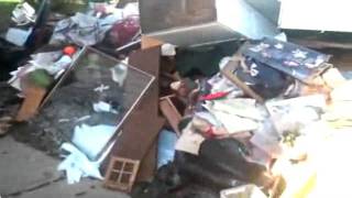 RAW VIDEO: After The Flood, Residents Pile Up Ruined Possessions