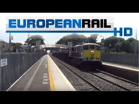 Irish Rail 071 loco 086 + ore wagons pass Donabate