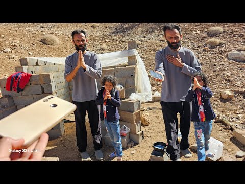 Mustafa and his daughter were thrilled with the gift of a mobile phone!|Renovating the cottage