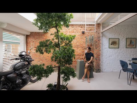 Inside A Biker Couple's 1940s Heritage Shophouse With A Motorcycle Garage