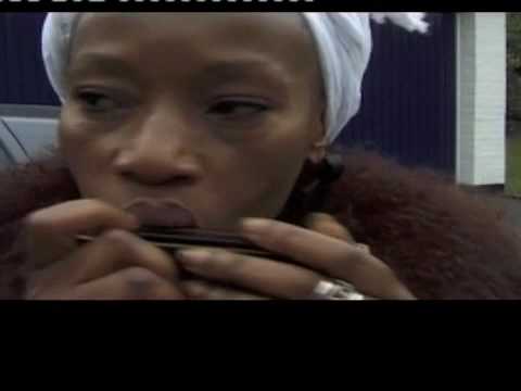 Busi Mhlongo playing harmonica UK 1998