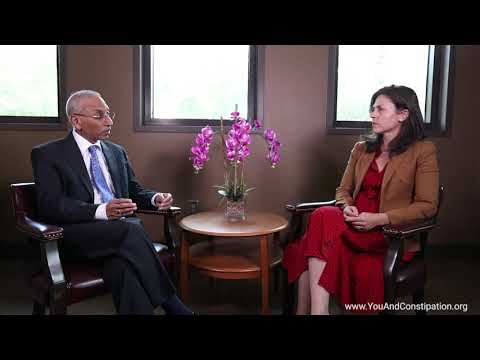 What are the symptoms of dyssynergic defecation?