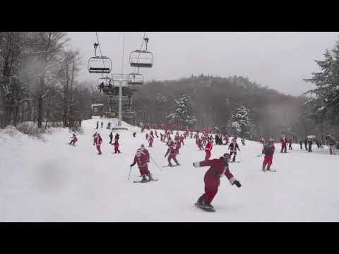 Hundreds of skiing and snowboarding jolly Old St Nicks hit the slopes Sunday in Maine for a good cause. About 300 red-suited lookalikes gathered for the 19th annual Santa Sunday in the tiny western Maine town of Newry. (Dec. 2)