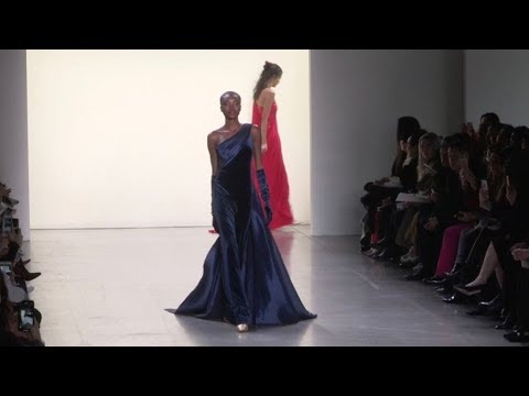 Models and designer on the runway for the Tadashi Shoji Fashion Show in New York City