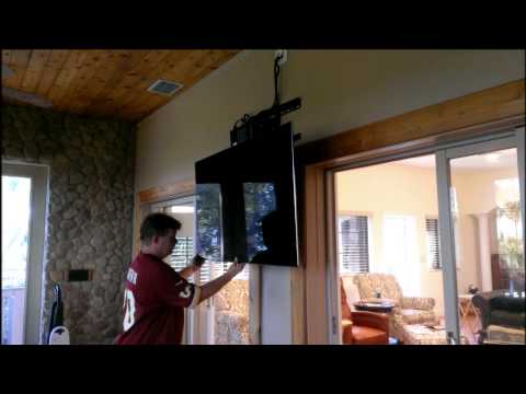 Demonstrating a Newly-Installed Pull-Down TV Mount