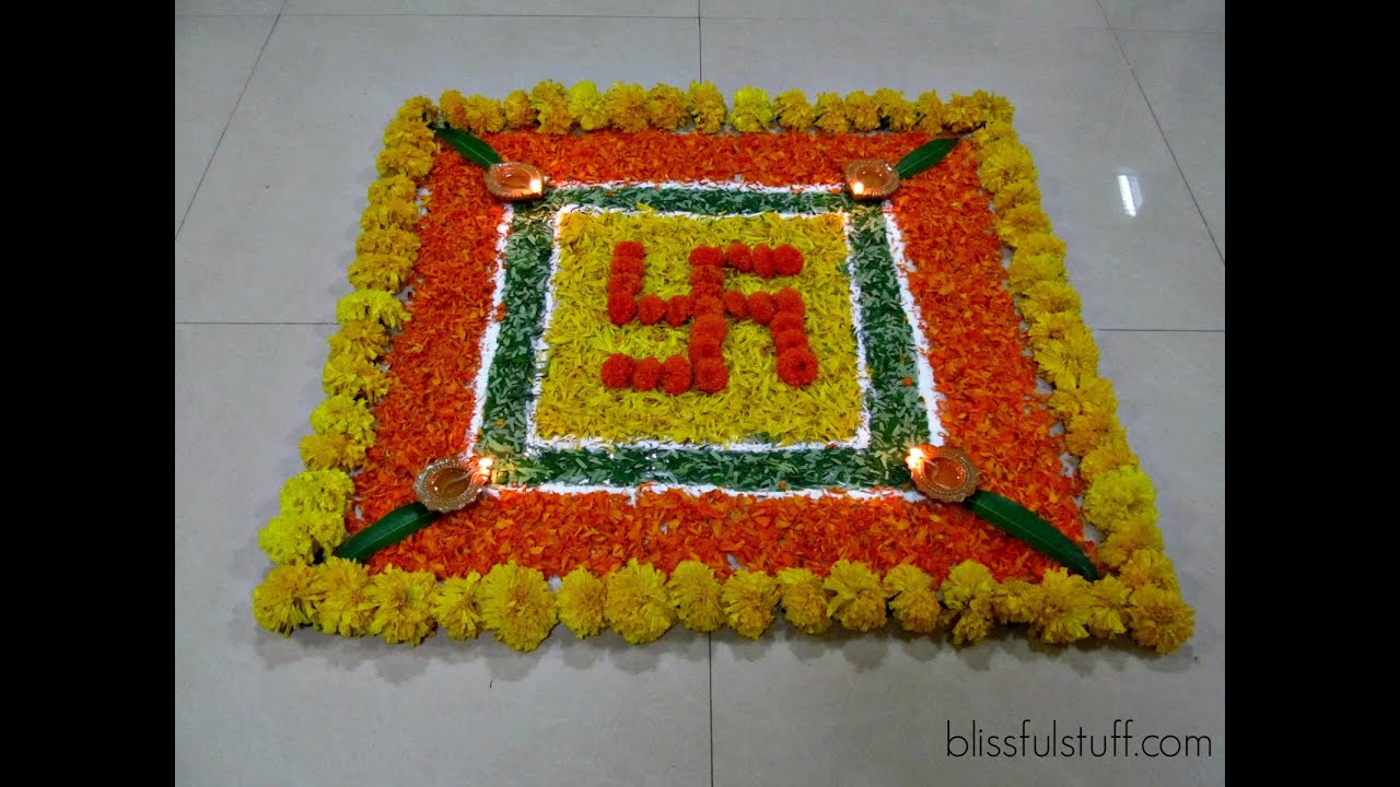 Onam pookalam design using marigold flowers by Poonam Borkar