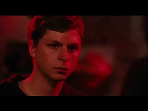 Audience POV: end-credits glow over dawn Manhattan while piano from the soundtrack swells