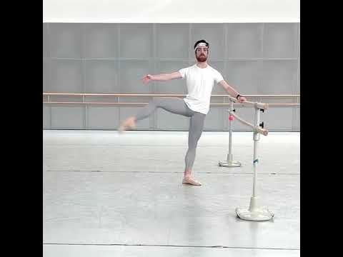 Male ballet dancer, fondu at the barre