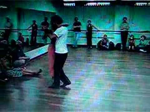  Ezequiel Paludi  and  Geraldine Paludi  are  dancing  to  the  tango  "  Si La Llegaran A Ver  "