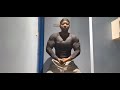 black muscle man flexing in tight shirt
