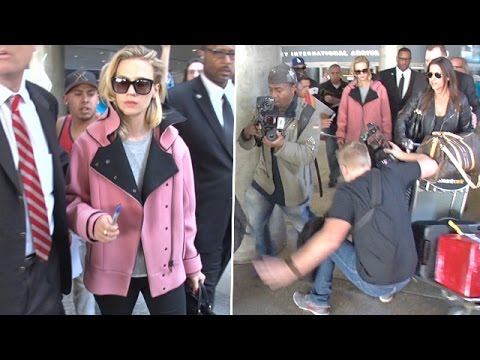 Photographer Falls At January Jones' Feet At LAX