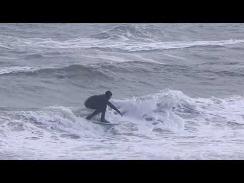 Surfing in Port Phillip Bay at Carrum Beach