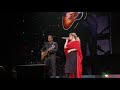 Kelly Clarkson gets surprised by her husband on stage while she performs "piece by piece".