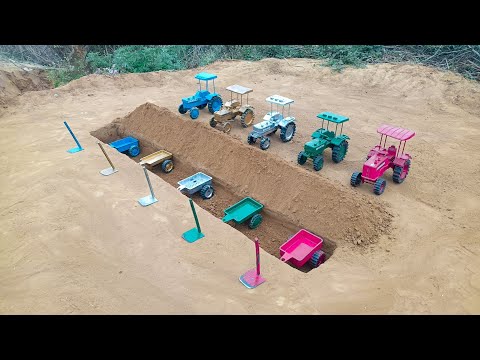 The tractor trolley stopped in a pit near the embankment that carried water to the field#290