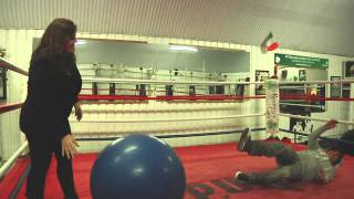 BALL HIT - a big ball knocks a man to the ground