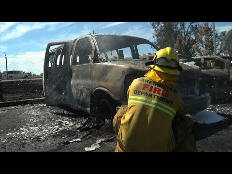 A brushfire burned 86 cars at a CarMax automobile dealership lot in Bakersfield, California. Authorities received reports Monday afternoon of several grass fires erupting along State Route 99 in the Central California city. (June 25)
