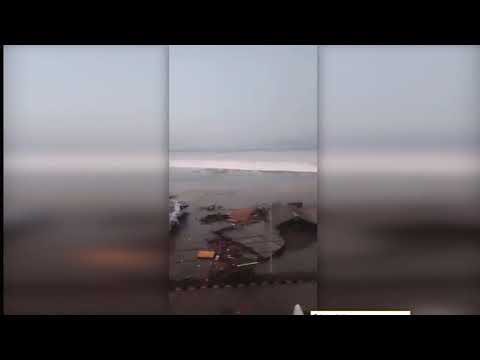 Scary moment tsunami hits Indonesia town people run for lives