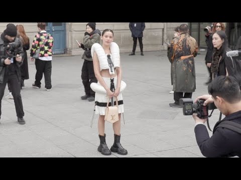 Urassaya Sperbund and Sharon Alexie at the Louis Vuitton Fashion Show in Paris