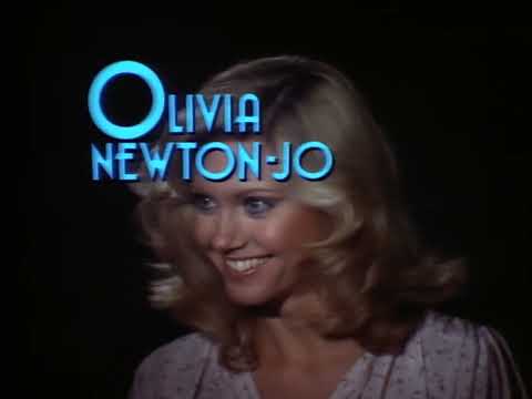 Original trailer end-card; neon title over black as the theme swells