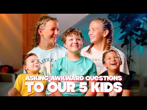 Five smiling kids posing indoors for a video thumbnail; bold title text across bottom reads 'Asking awkward questions to our 5 kids'.