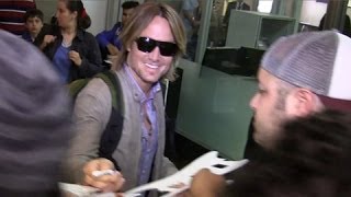 Keith Urban Arrives To Adoring Fans At LAX