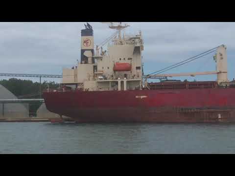 Sarnia harbor.  big old rusty freighter loading its cargo I believe grain