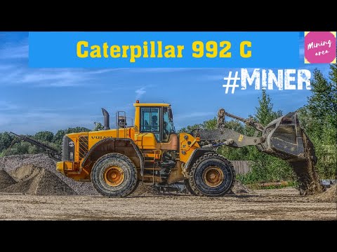 Caterpillar 992C Wheel Loader Loading Coal On Trucks.......