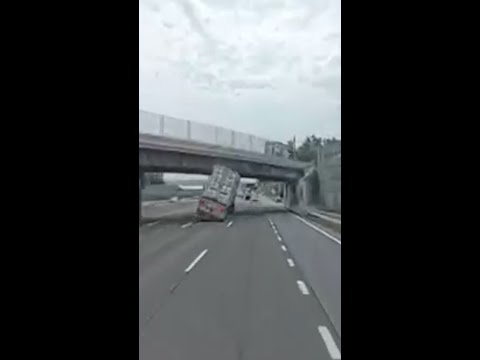Tractor trailer slams into overpass and flips in New York