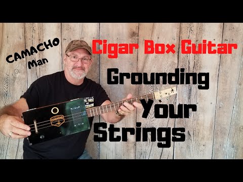 How to build a 3 string Cigar Box Guitar - Grounding your Strings.