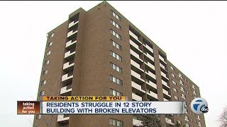 Residents struggle in 12 story building with broken elevators