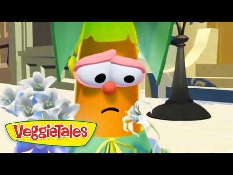 Sad orange carrot character with pink glasses and a frown from VeggieTales.
