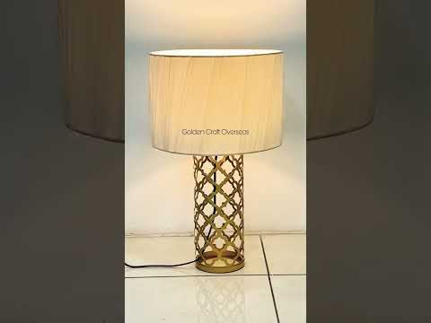 Designing table lamp in iron with golden powder coated finis...