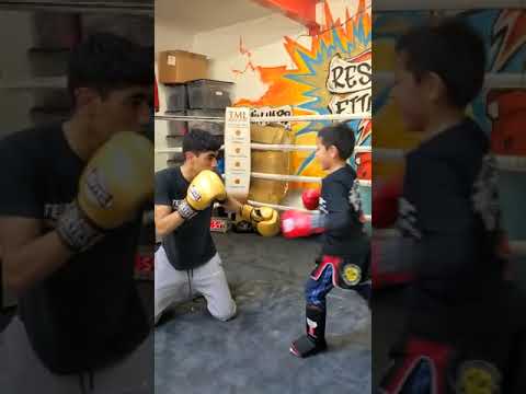 Kickboxing sparing session kid vs his trainer Respect Fitness Leicester