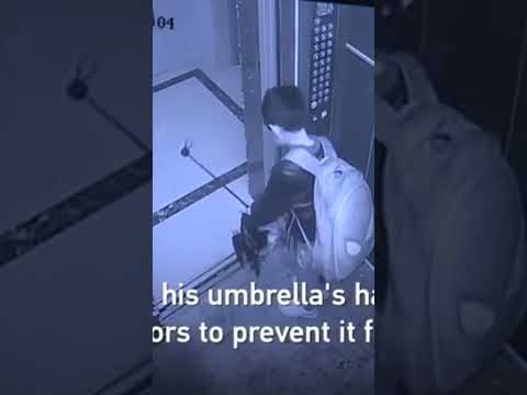 Boy uses umbrella to prevent elevator door from closing, causes free fall 😮 #cgtv