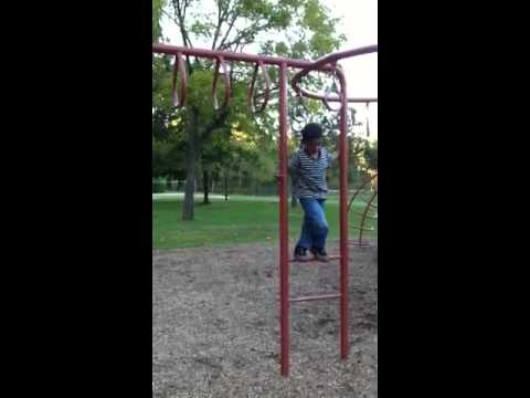 Veeresh is doing swings on monkey bar