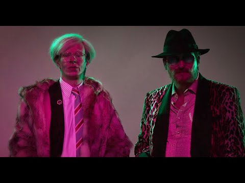 ALEXANDER SCHEER as ANDY WARHOL and OLIVER MASUCCI as RAINER WERNER FASSBINDER