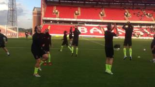 WARM-UP: The lads limber up before facing Barnsley