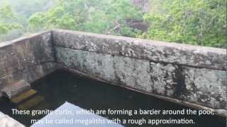Ancient pool with evidence of machine processing, wholly carved in stone above Throne Room, Sigiriya