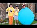Jason and Alex wear a fun giant balloon challenge