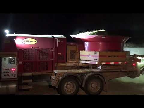 Haybuster grinding round bales