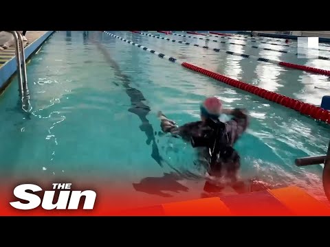 Russian children take part in swimming contest with Kalashnikovs