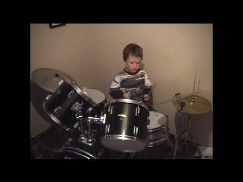 kiwi kid Sam aged 8 playing drums