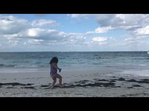 Liya  is playing at beach 🏖 her first vacation to Mexico.
