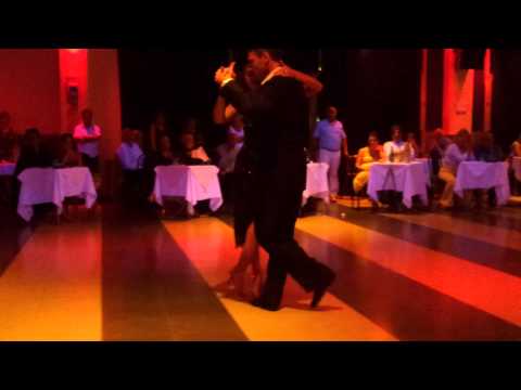  Santiago Fina  and  Samantha Dispari  are  dancing  to  a  tango